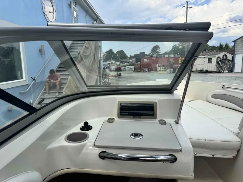 Slide: The Image of 2009 Stingray 195 FX Fish & Ski boat interior with seating and dashboard view. - 10