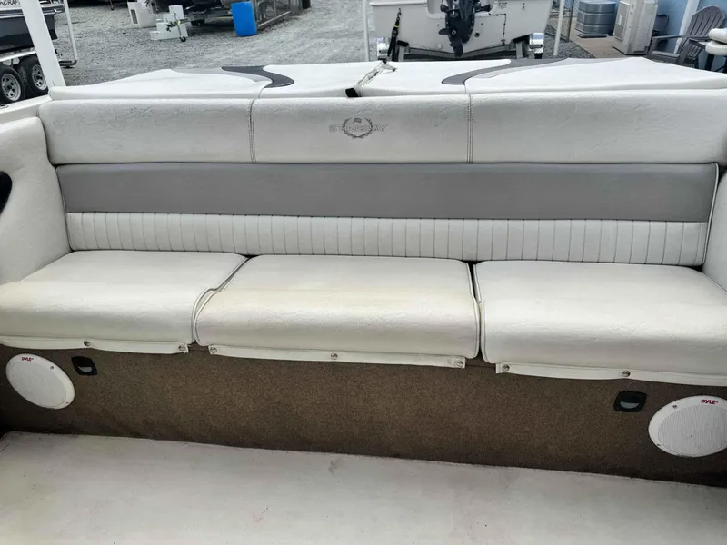 Slide: The Image of 2009 Stingray 195 FX Fish & Ski boat interior seating with white and gray upholstery. - 12