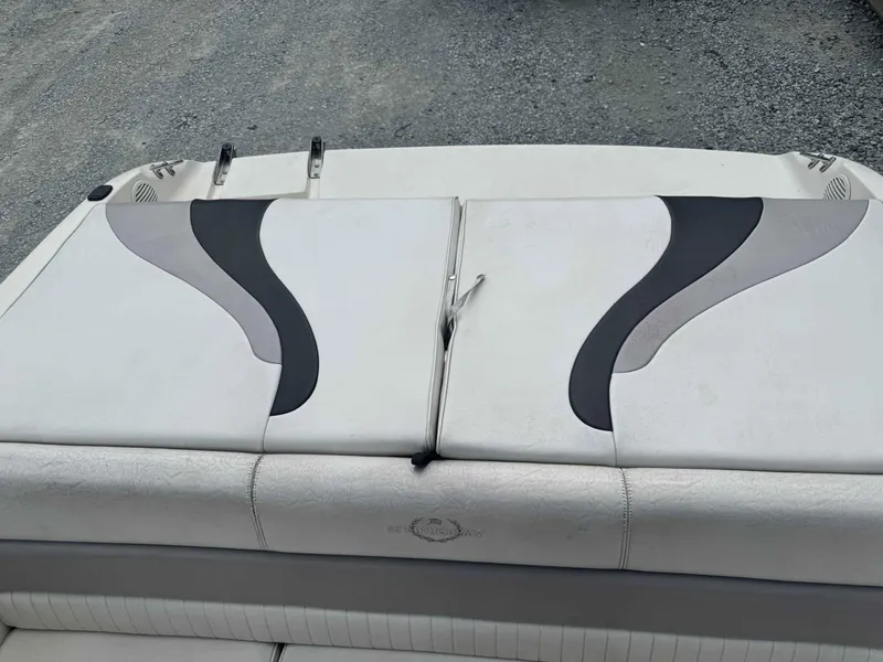 Slide: The Image of 2009 Stingray 195 FX Fish & Ski boat with cushioned seating and sleek design. - 13