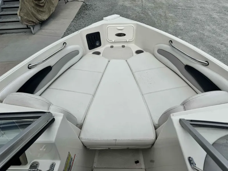 Slide: The Image of 2009 Stingray 195 FX Fish & Ski boat interior with white cushioned seating. - 4