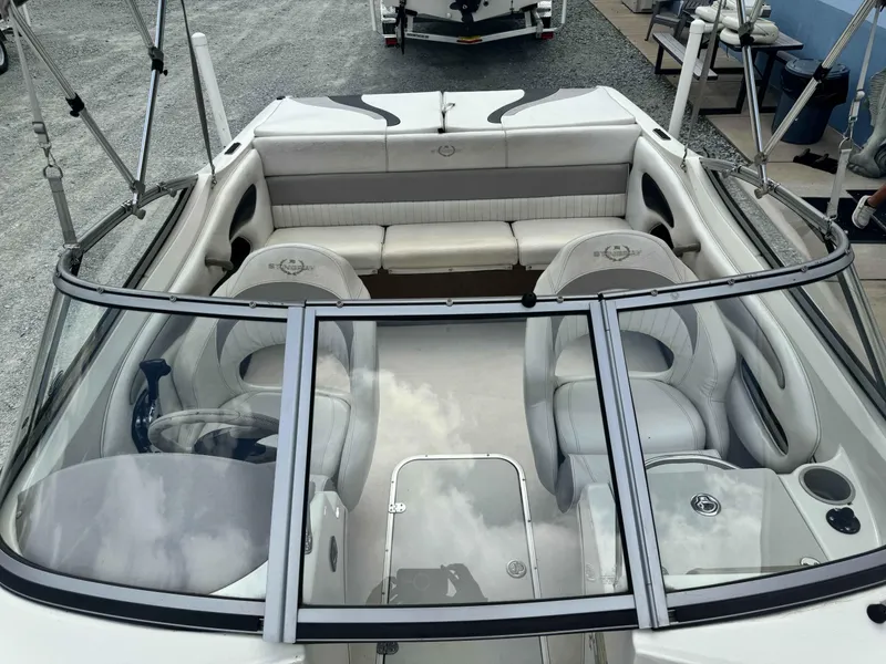 Slide: The Image of 2009 Stingray 195 FX Fish & Ski boat interior with seating and steering wheel. - 8