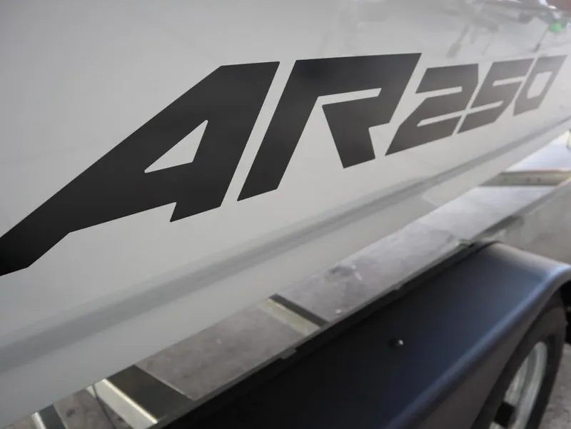 Slide: The Image of 2025 Yamaha Boats AR250 logo on boat hull. - 10
