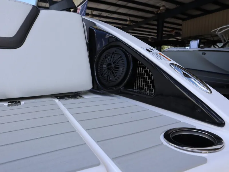 Slide: The Image of 2025 Yamaha AR250 boat interior with speaker and cup holder. - 15