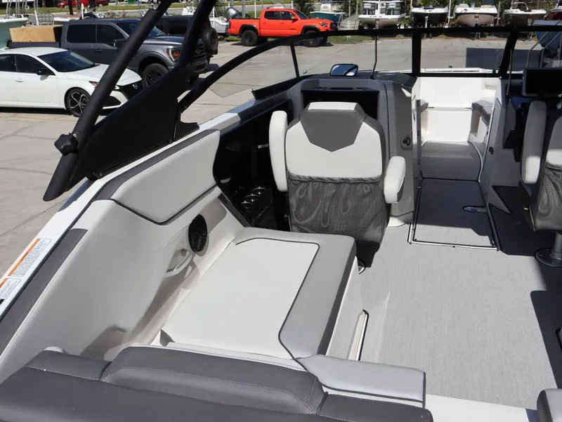 Slide: The Image of 2025 Yamaha Boats AR250 interior with modern seating and sleek design. - 17