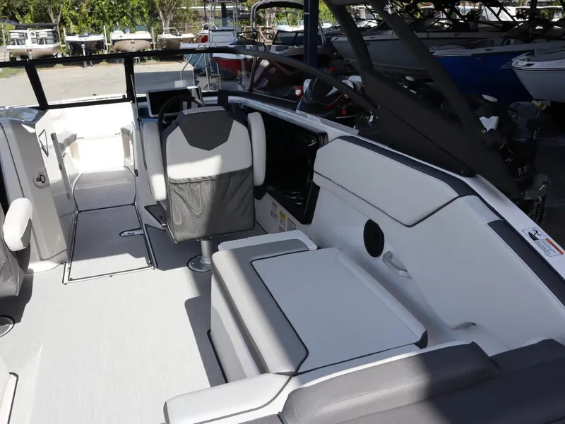 Slide: The Image of 2025 Yamaha AR250 boat interior with modern seating and sleek design. - 18