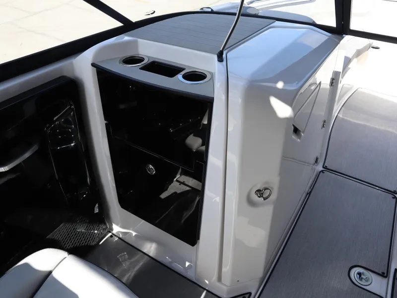 Slide: The Image of Interior view of 2025 Yamaha Boats AR250, featuring sleek design and cup holders. - 21