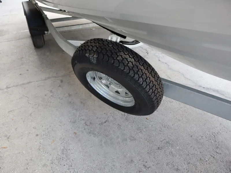 Slide: The Image of 2025 Yamaha AR250 boat trailer tire on concrete surface. - 22