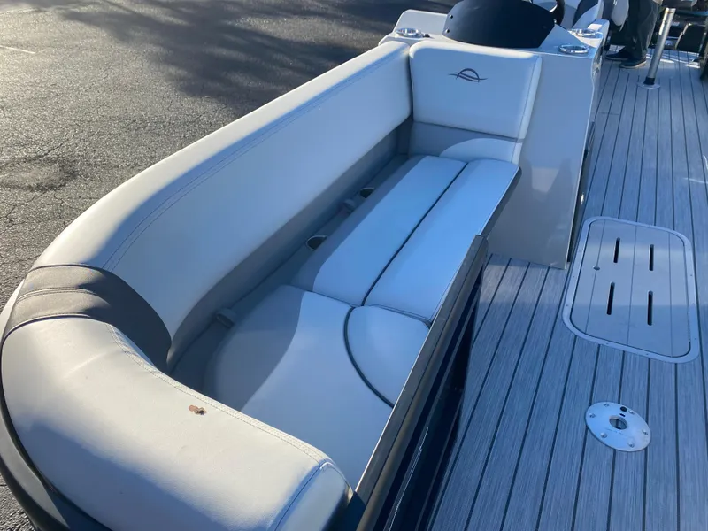 Slide: The Image of 2025 SunCatcher Select 322RC boat interior with sleek seating and modern design. - 11