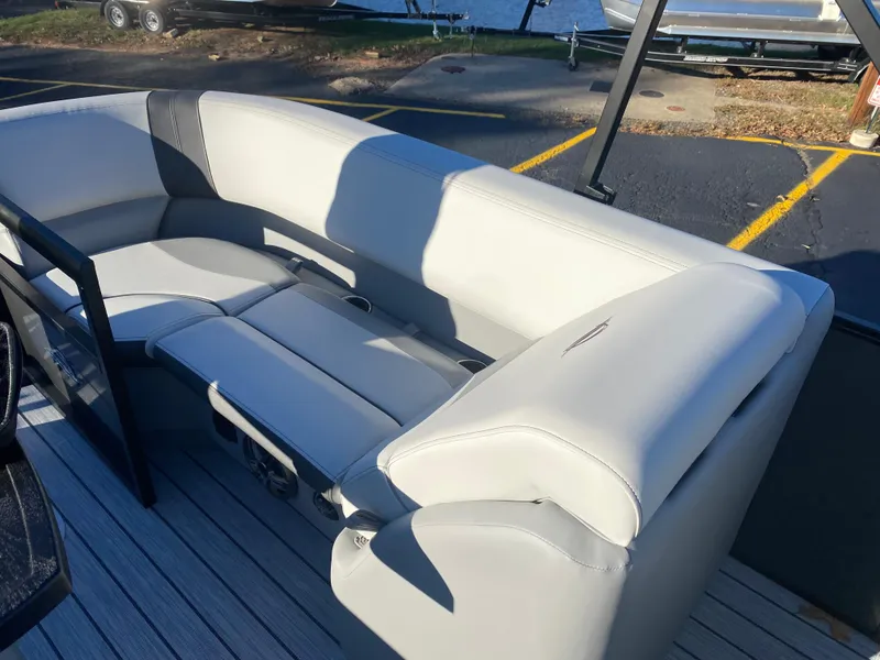 Slide: The Image of 2025 SunCatcher Select 322RC boat interior with sleek, modern seating and spacious layout. - 13
