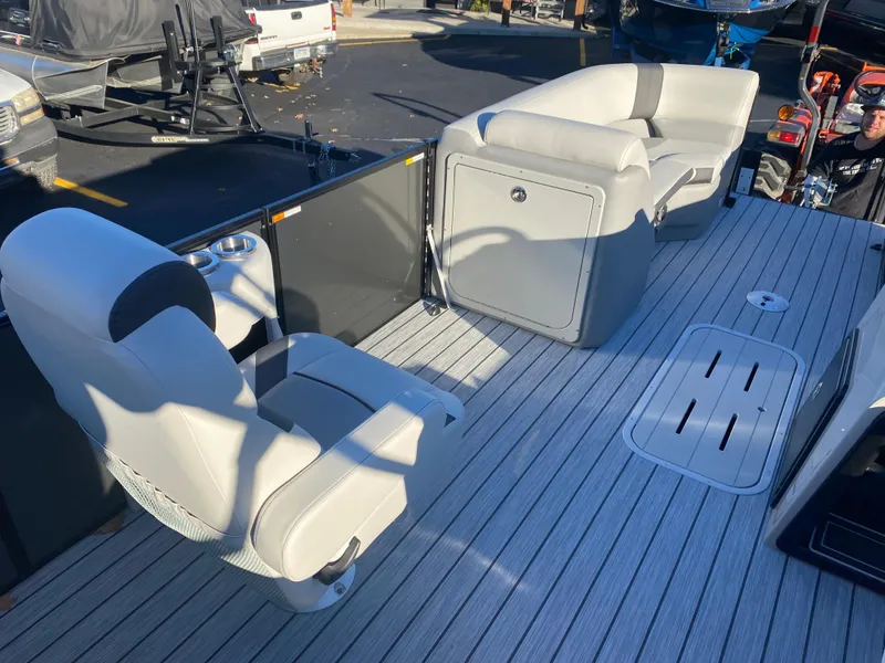 Slide: The Image of Luxurious 2025 SunCatcher Select 322RC boat interior with plush seating and sleek design. - 14