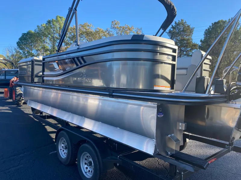 Slide: The Image of 2025 SunCatcher Select 322RC pontoon boat on trailer, parked outdoors. - 6