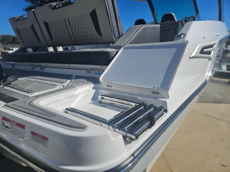 Slide: The Image of 2025 Monterey Elite 30 OB boat with sleek seating and modern design. - 13