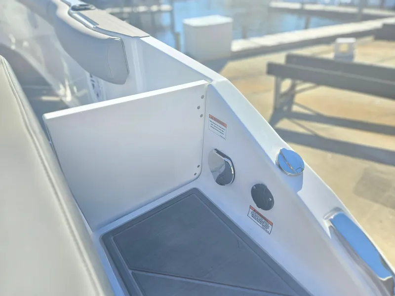 Slide: The Image of 2025 Monterey Elite 30 OB boat interior detail with controls and seating. - 15