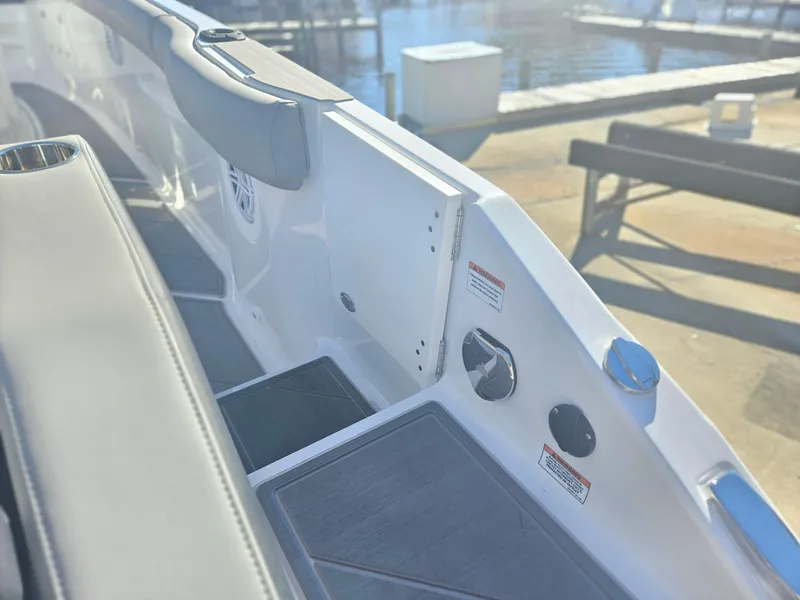 Slide: The Image of 2025 Monterey Elite 30 OB boat interior with sleek seating and modern design. - 16