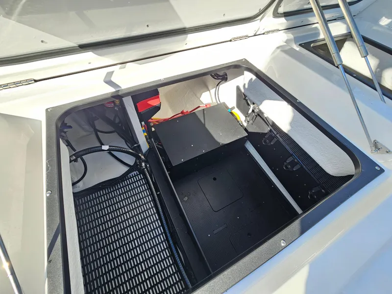 Slide: The Image of Open engine compartment of 2025 Monterey Elite 30 OB boat. - 20