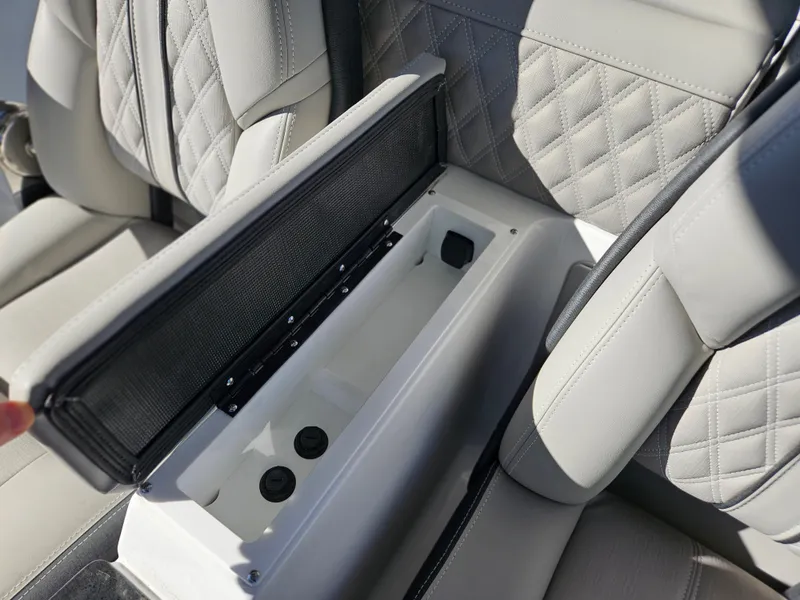 Slide: The Image of 2025 Monterey Elite 30 OB boat seat with open storage compartment. - 29
