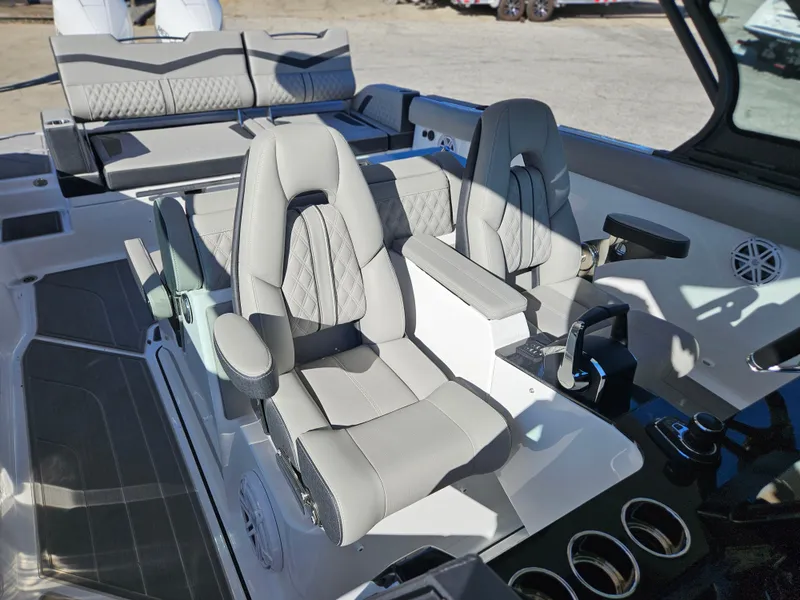 Slide: The Image of 2025 Monterey Elite 30 OB boat interior with luxurious seating and modern controls. - 32