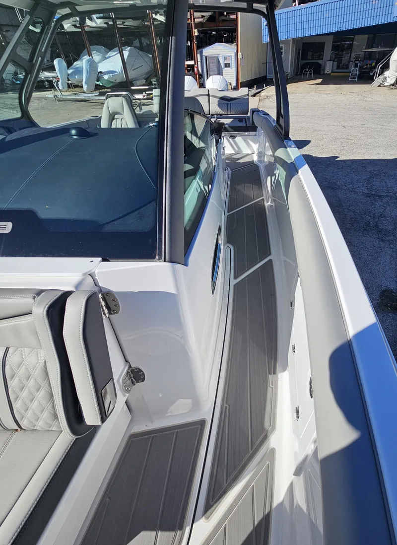 Slide: The Image of 2025 Monterey Elite 30 OB boat with sleek design and modern features. - 33