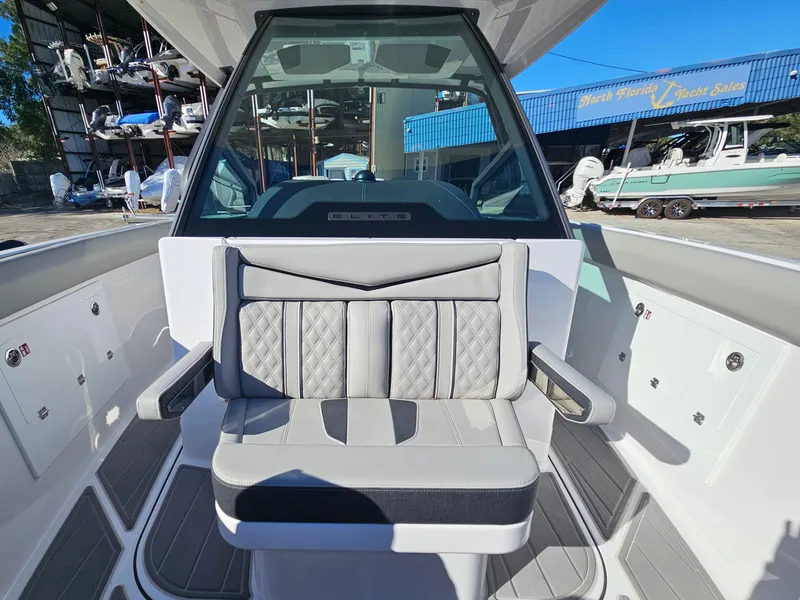 Slide: The Image of 2025 Monterey Elite 30 OB boat interior with modern seating and dashboard. - 42