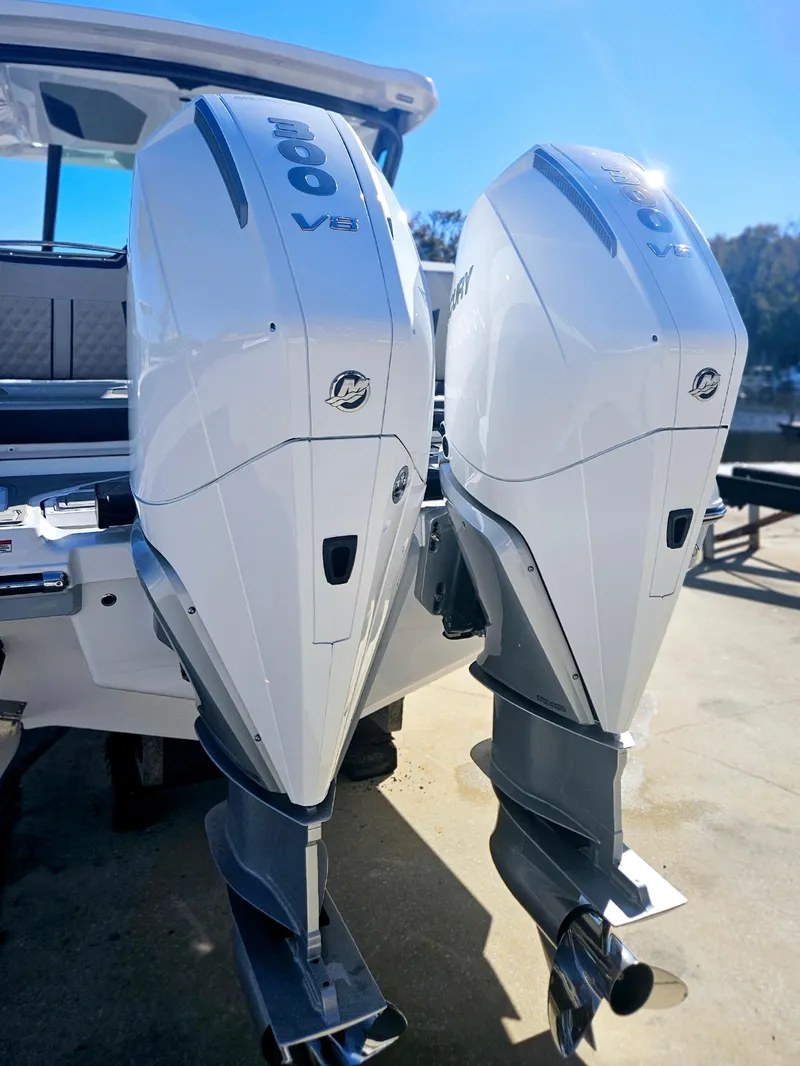 Slide: The Image of 2025 Monterey Elite 30 OB with dual outboard engines, sleek design, and modern features. - 5