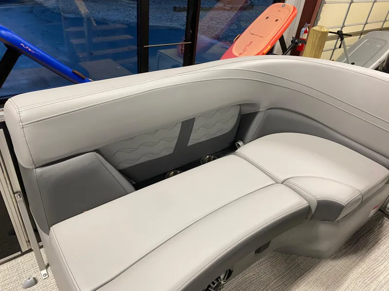 Slide: The Image of SunCatcher Fusion 324SS 2025 boat interior with sleek gray seating. - 16
