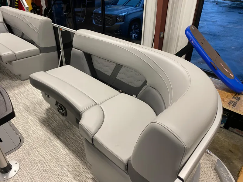 Slide: The Image of 2025 SunCatcher Fusion 324SS boat interior with gray seating and modern design. - 21