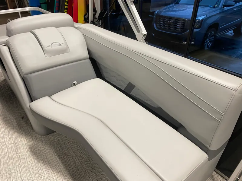 Slide: The Image of 2025 SunCatcher Fusion 324SS boat interior with sleek gray seating and modern design. - 22