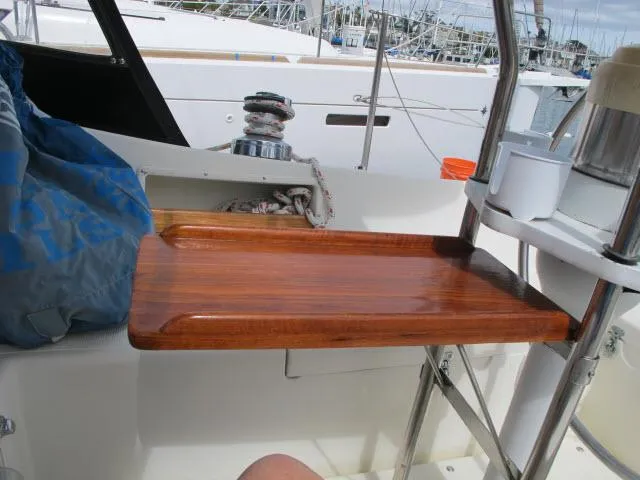 Slide: The Image of Wooden cockpit table on 1987 Pacific Seacraft PS37 sailboat, docked in marina. - 20