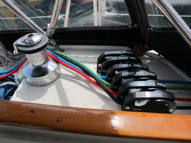 Slide: The Image of Sailing controls on 1987 Pacific Seacraft PS37, featuring colorful ropes and winch. - 25