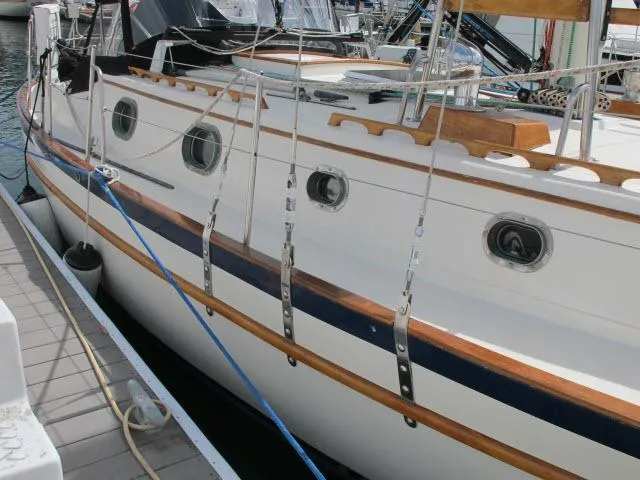 Slide: The Image of 1987 Pacific Seacraft PS37 sailboat docked, showcasing classic design and craftsmanship. - 31