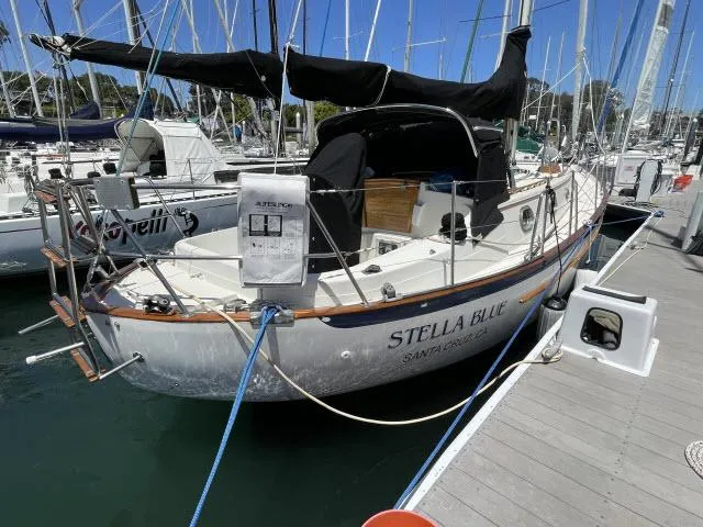 Slide: The Image of 1987 Pacific Seacraft PS37 sailboat "Stella Blue" docked in a marina. - 33