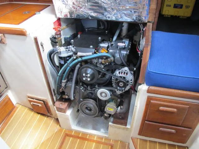 Slide: The Image of Engine compartment of a 1987 Pacific Seacraft PS37 sailboat, showcasing mechanical components. - 35