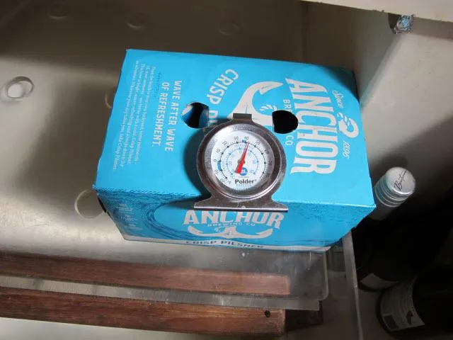 Slide: The Image of Thermometer on Anchor beer pack inside 1987 Pacific Seacraft PS37 boat. - 9
