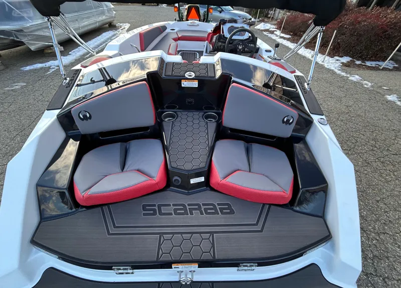 Slide: The Image of 2025 Scarab 165 LX boat interior with stylish seating and modern design. - 14