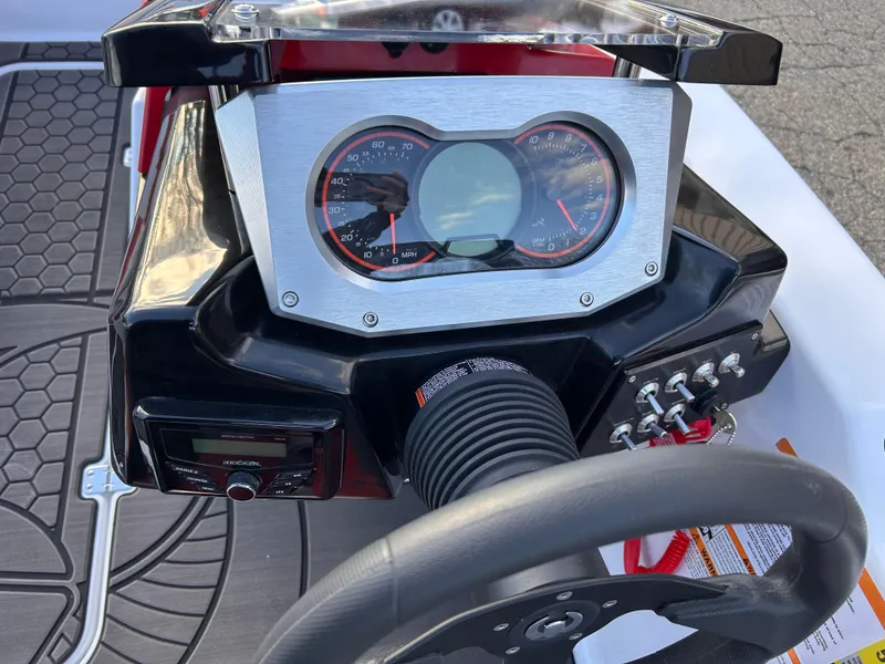 Slide: The Image of Dashboard of 2025 Scarab 165 LX boat with steering wheel and control panel. - 16