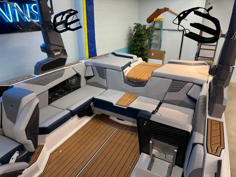 Slide: The Image of 2025 Nautique Super Air Nautique S21 interior with sleek seating and modern design. - 13