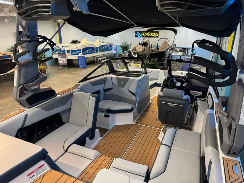 Slide: The Image of 2025 Nautique Super Air Nautique S21 interior with sleek seating and modern design. - 16