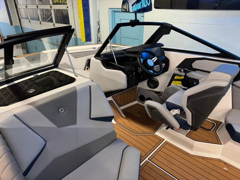 Slide: The Image of 2025 Nautique Super Air Nautique S21 interior with modern design and sleek dashboard. - 18