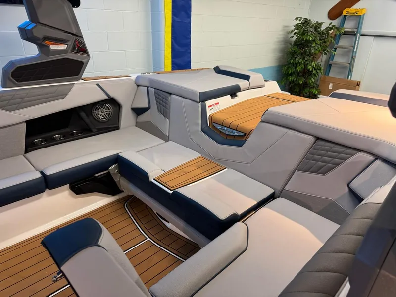 Slide: The Image of 2025 Nautique Super Air Nautique S21 interior with sleek seating and modern design. - 19