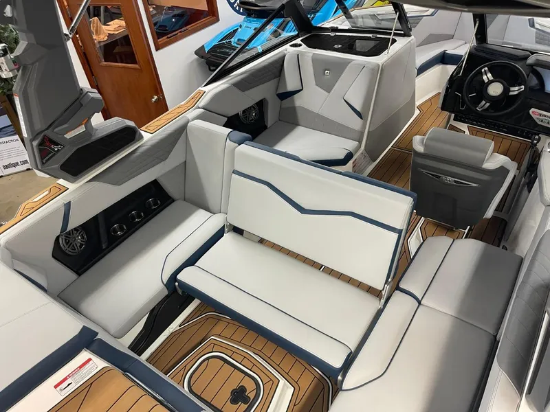 Slide: The Image of 2025 Nautique Super Air Nautique S21 interior with sleek seating and modern design. - 28