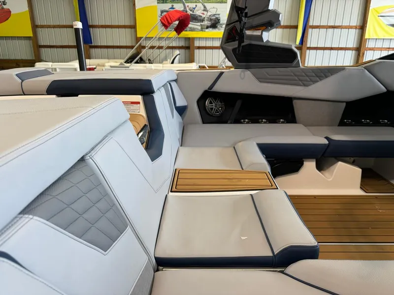 Slide: The Image of 2025 Nautique Super Air Nautique S21 interior with luxurious seating and modern design. - 9