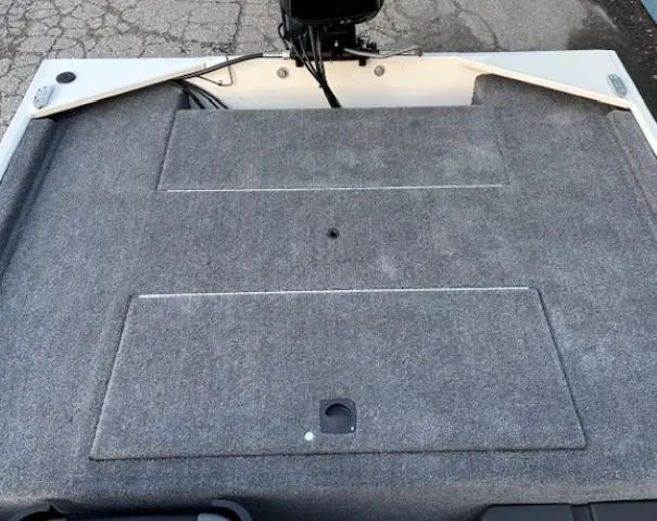 Slide: The Image of 2025 Tracker Bass Tracker Classic XL boat deck with gray carpeted surface. - 15