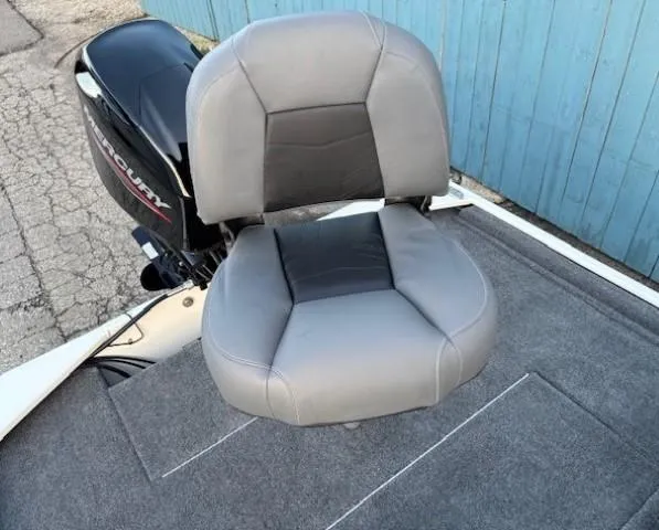 Slide: The Image of 2025 Tracker Bass Tracker Classic XL boat seat with Mercury motor, gray upholstery. - 16