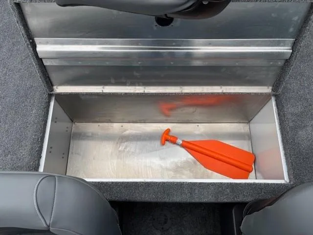 Slide: The Image of 2025 Tracker Bass Tracker Classic XL storage compartment with orange paddle. - 17