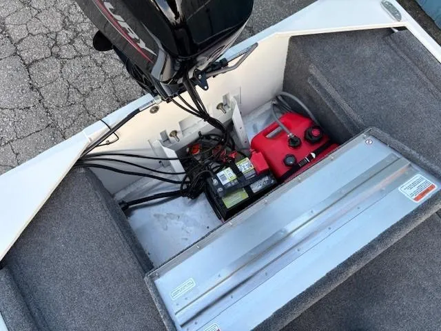 Slide: The Image of 2025 Tracker Bass Tracker Classic XL boat engine compartment with battery and fuel tank. - 18