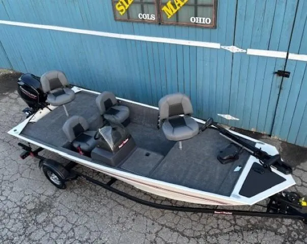 Slide: The Image of 2025 Tracker Bass Tracker Classic XL boat with gray seating, parked on a trailer. - 2