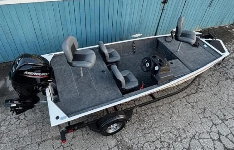 Slide: The Image of 2025 Tracker Bass Tracker Classic XL fishing boat with Mercury engine, parked on trailer. - 3