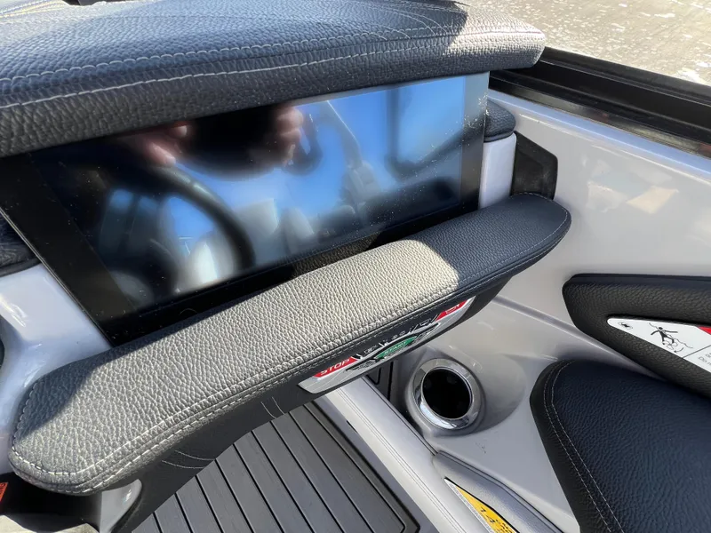 Slide: The Image of 2020 Nautique G21 boat dashboard with touchscreen display and leather accents. - 23