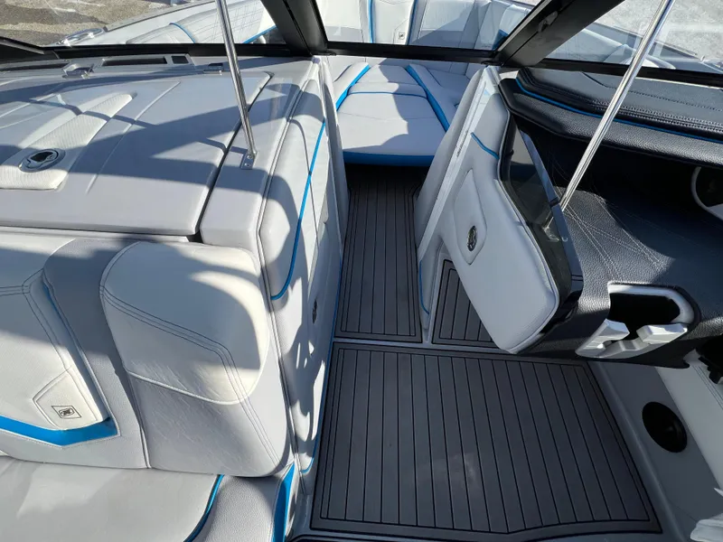 Slide: The Image of 2020 Nautique G21 boat interior with sleek seating and modern design. - 24