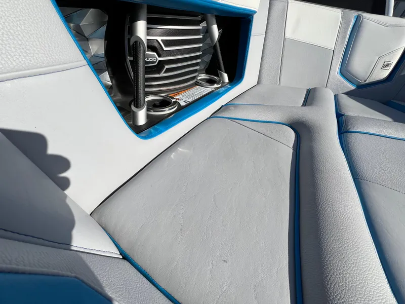Slide: The Image of 2020 Nautique G21 interior with premium audio system and sleek seating design. - 27